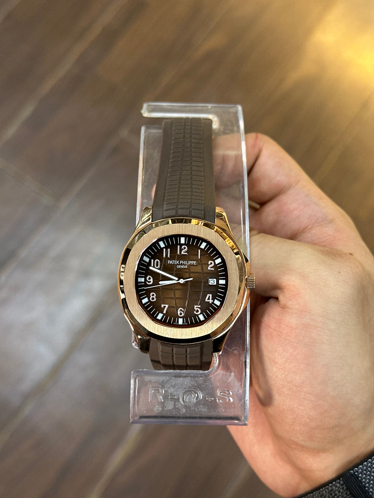 Aquanaut rose gold — held in hand, showing size