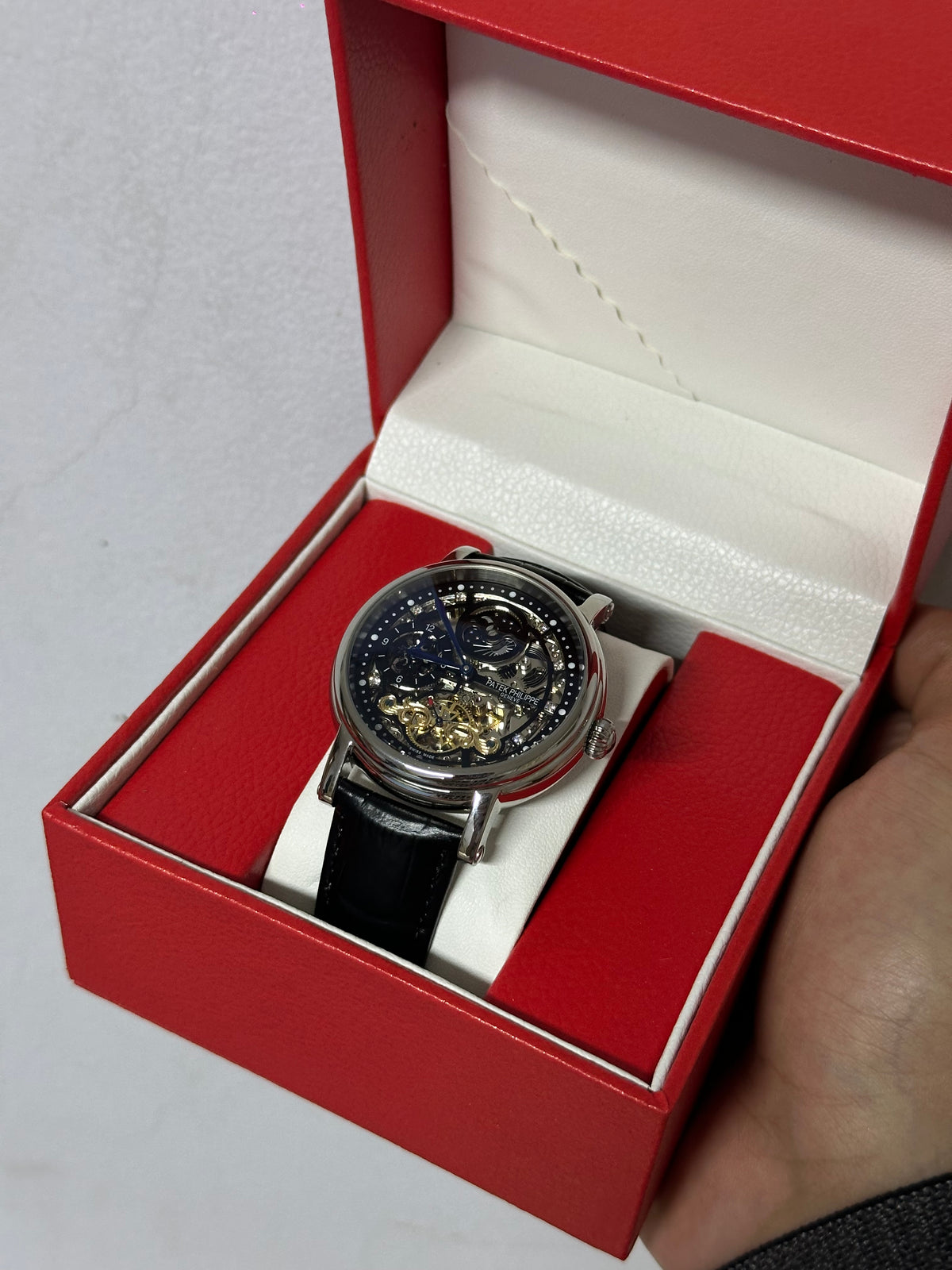 Skeleton moon phase watch — leather strap detail