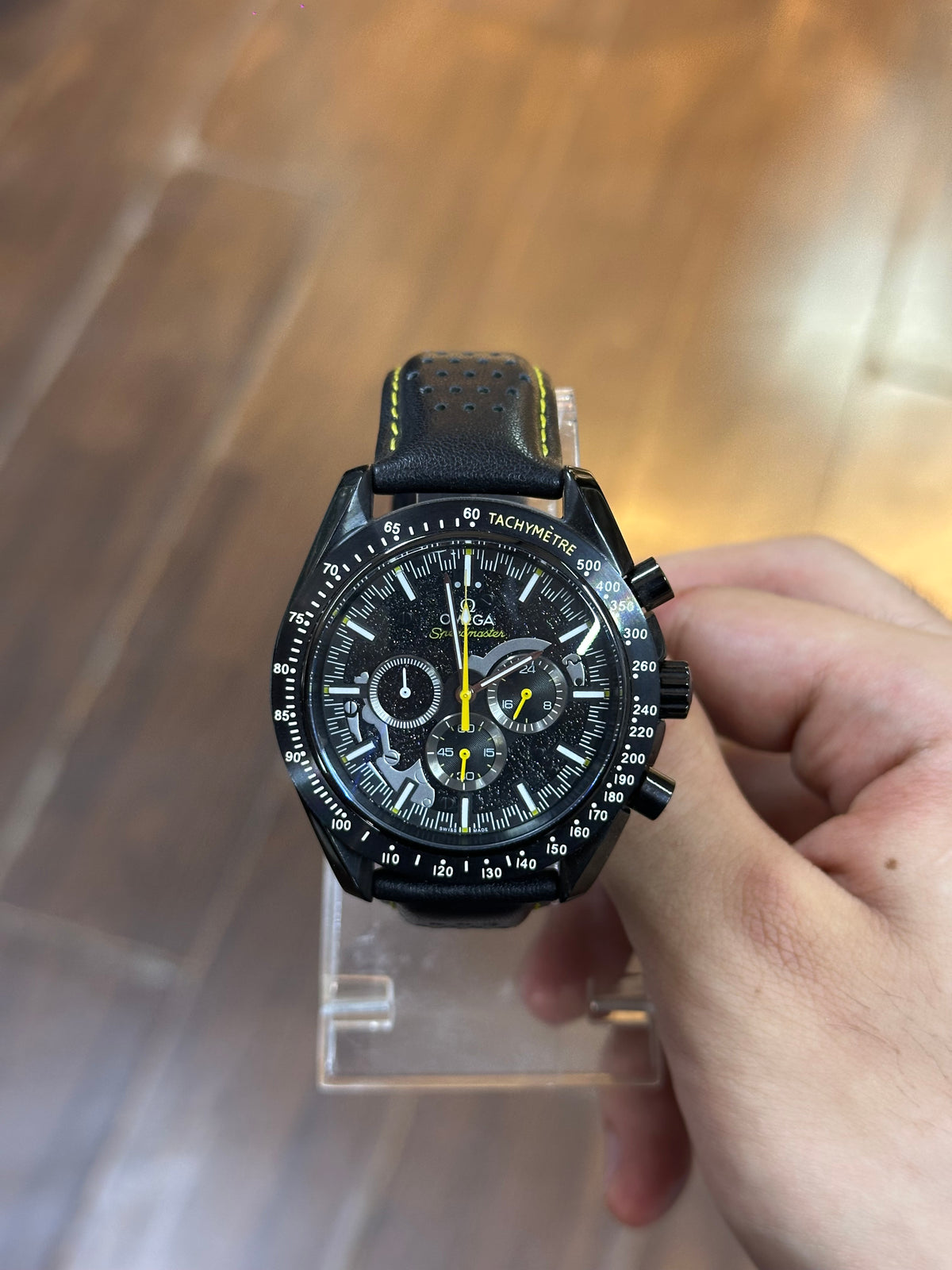 Speedmaster Dark Side of the Moon — held in hand, showing size