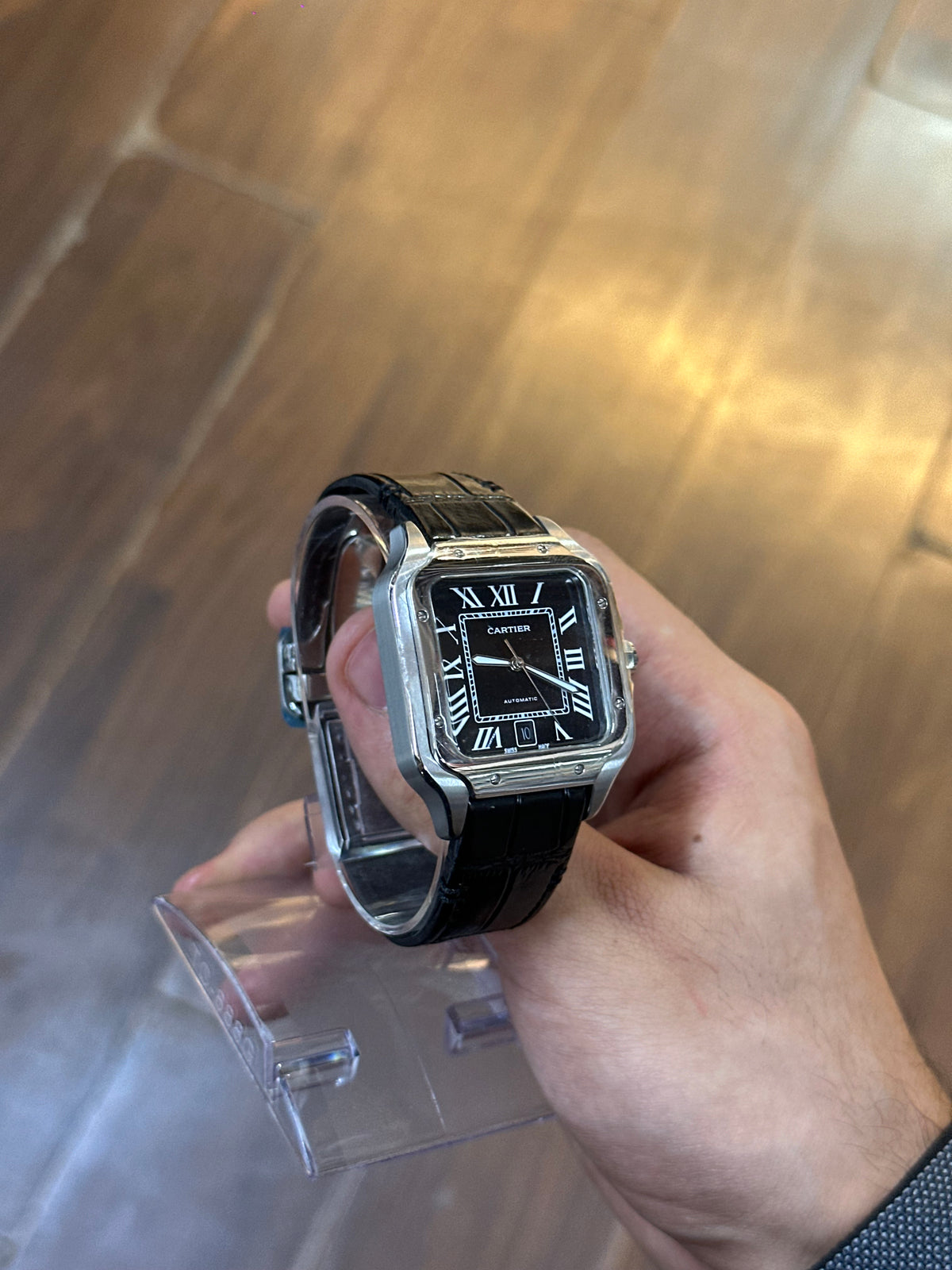 Santos, black dial — grey leather strap detail