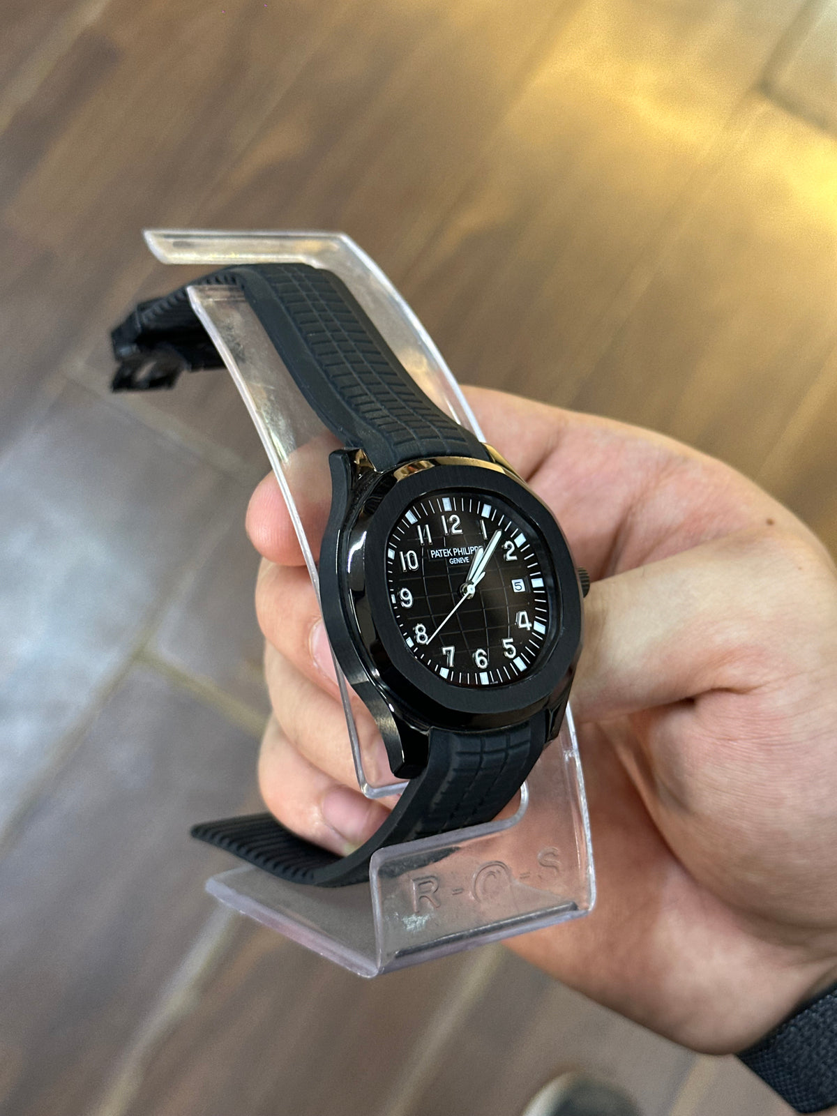 Dress watch, black dial — case profile and crown