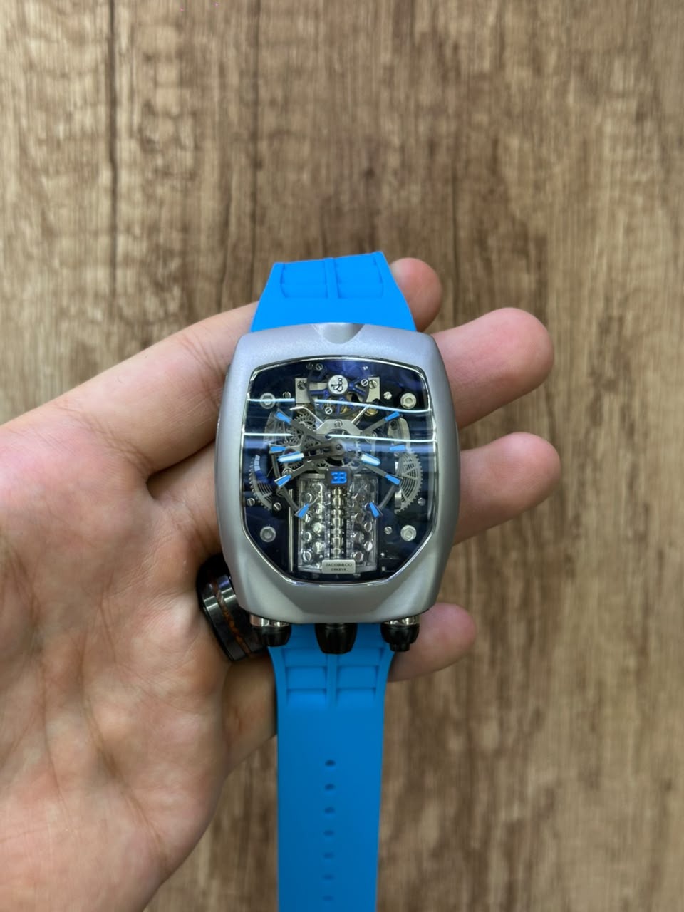 Bugatti Chiron Tourbillon held in hand, showing the size of the tonneau case
