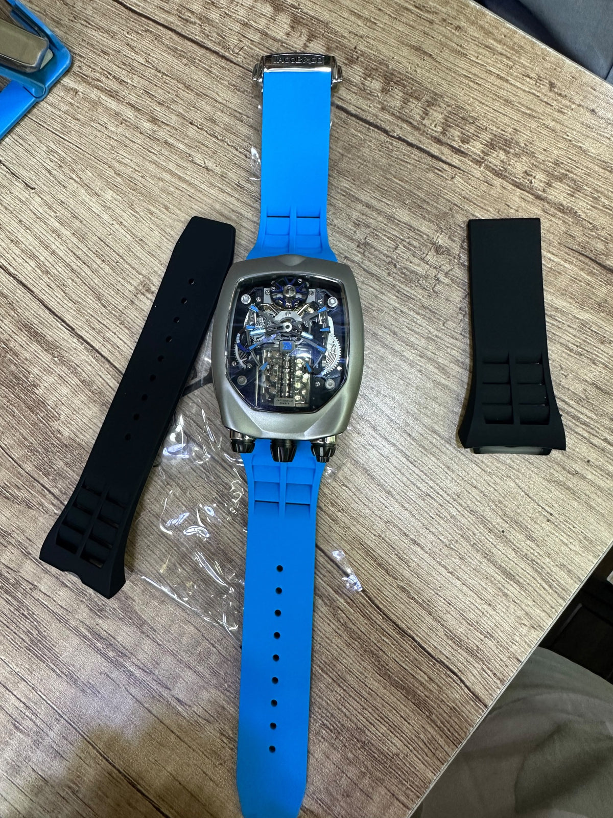 Bugatti Chiron Tourbillon shown with the two spare black rubber straps included