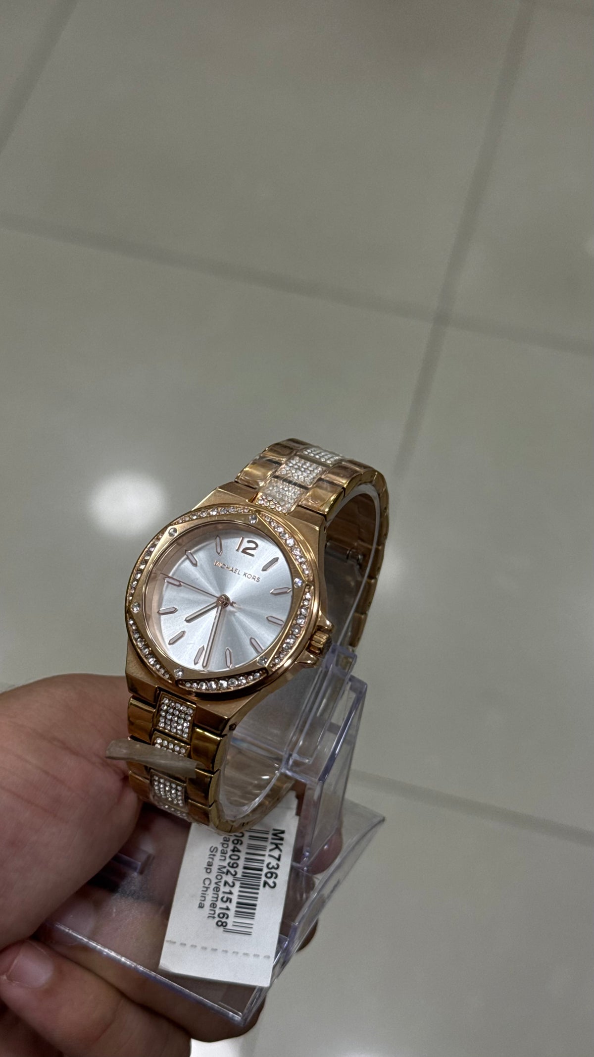 Michael Kors Lennox in hand - pave bezel and crystal-set bracelet links, with the original tag attached