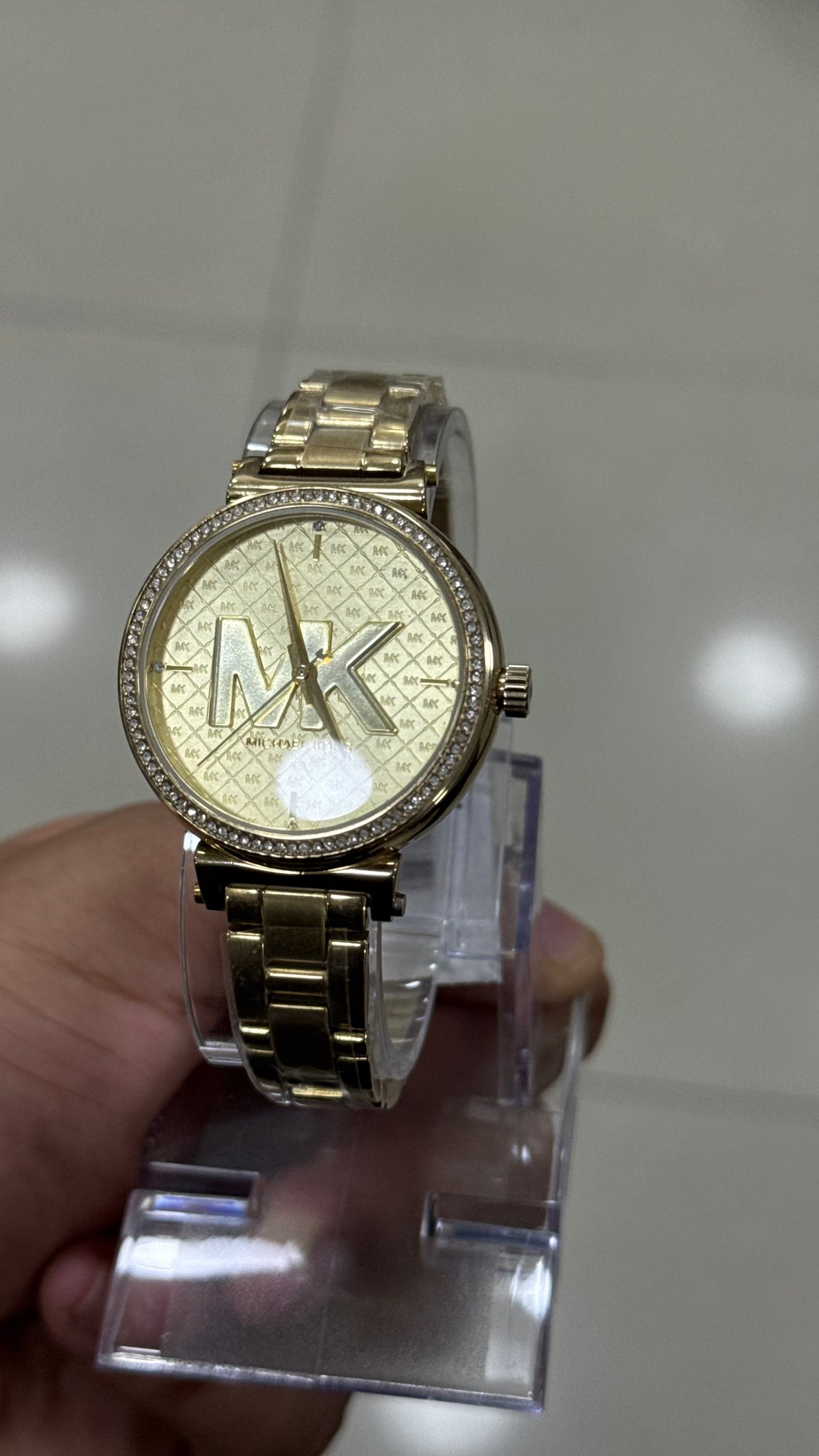 Michael Kors Sofie MK4334 - close view of the raised MK logo and monogram pattern